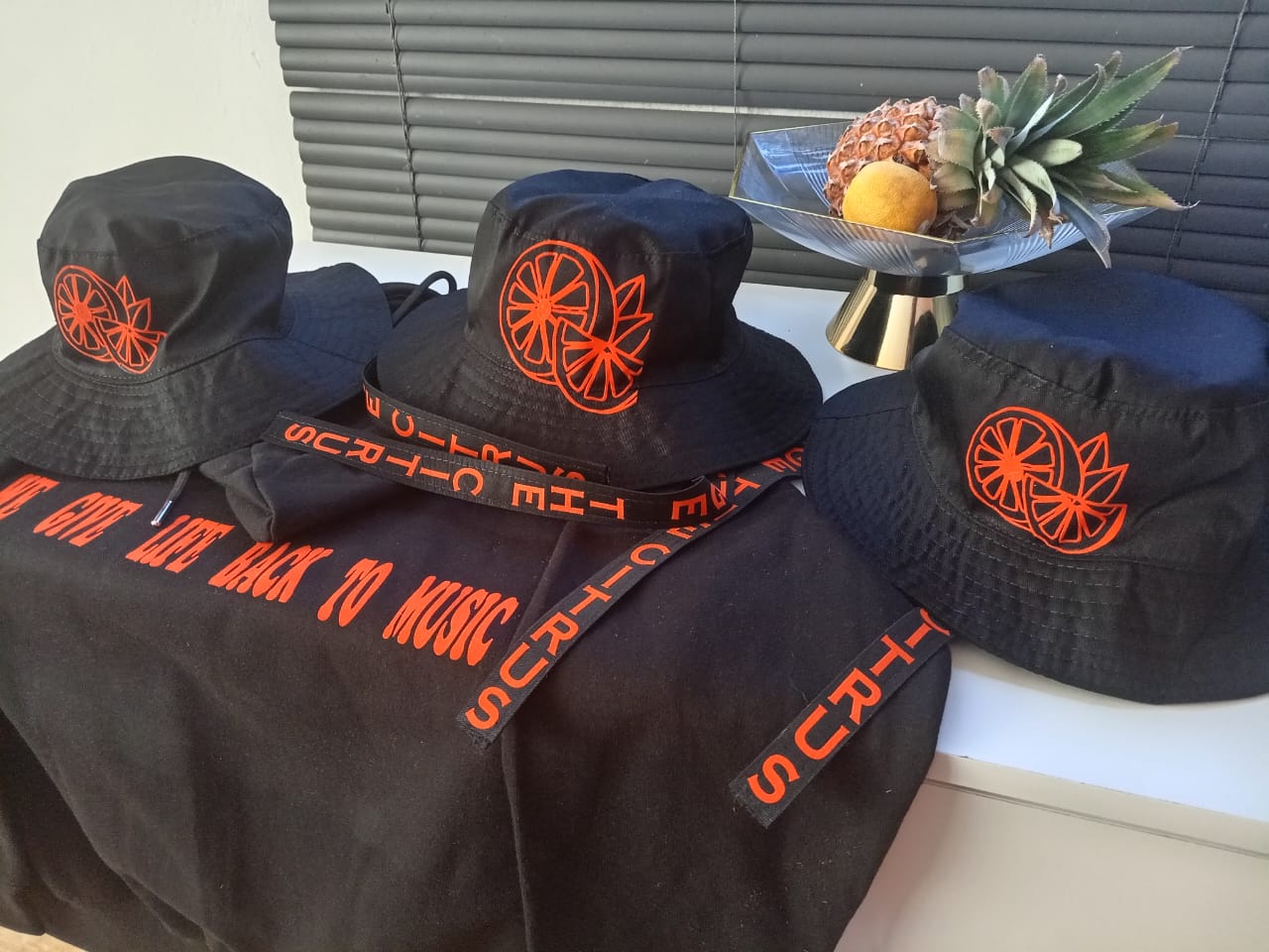 Black Orange The Citrus branded apparel arranged as a collection